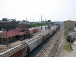 SB freight eases into the yard past the depot and the tower